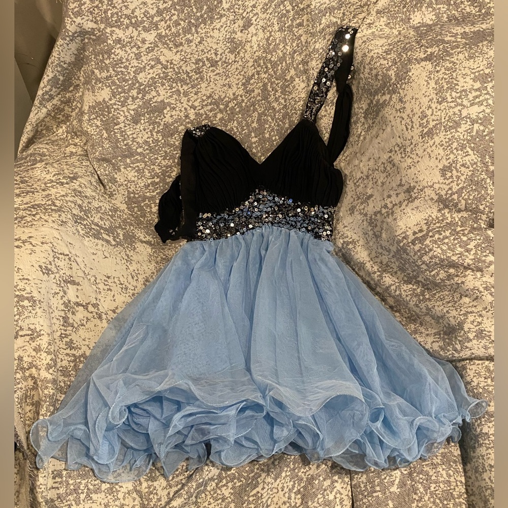 Blondie Nites by Stacy Skylar. Short blue/black backless dress